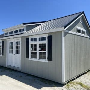 Premier Shed with residential double doors, transom window gables, and transom window dormer.