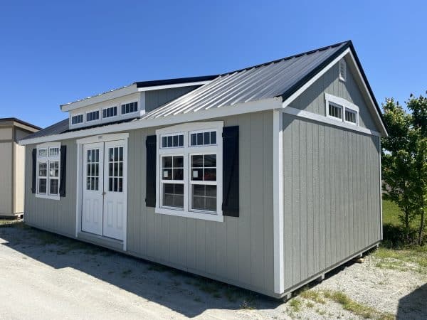 Premier Shed with residential double doors, transom window gables, and transom window dormer.